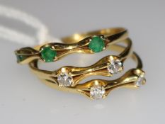 An 18ct gold, emerald and diamond triple band ring, size O.