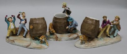 A collection of three Volkstedt porcelain spill vases, with gentleman avoiding tigers, largest 6.