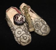 A pair of silkwork child's shoes, a French bronze desk seal and a small pot