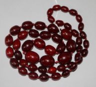 A simulated cherry amber necklace, 92cm.