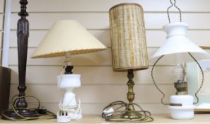 Two opaque white glass lamps and wood lamp base and another