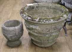A composition stone garden urn and a smaller ditto, W.52cm and W.23cm