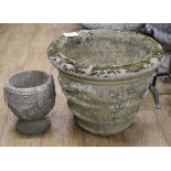 A composition stone garden urn and a smaller ditto, W.52cm and W.23cm