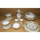 A Royal Doulton thirteen piece breakfast set, decorated with tulips