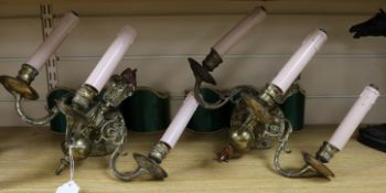 A pair of Edwardian Dutch brass three branch wall lights and a firescreen