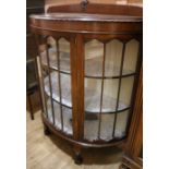 A bow-front mahogany china display cabinet, W.110cm