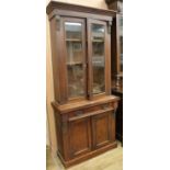 A late Victorian walnut glazed bookcase, H.203cm