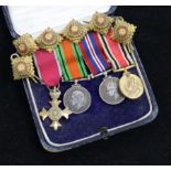 A cased group of miniatures including MBE and six epaulette pips