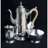 A matched three-piece silver coffee set, London 1961-1963, makers D. & J. Welby Ltd, comprising