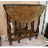 A small oval oak gateleg table, W.59cm