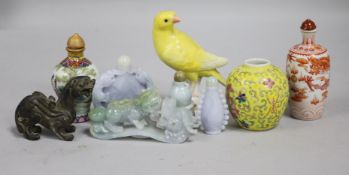 A collection of Chinese snuff bottles, jadeite carvings and a Meissen canary