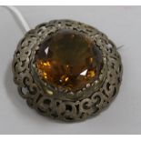 A large Victorian Scottish pierced silver mounted citrine brooch, 6.5cm.