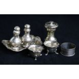 Two cauldron salts, a pepper mill, two .800 standard pepper pots, a napkin ring and a bon bon dish.