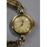 A lady's 9ct gold Omega manual wind wrist watch.