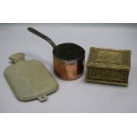 An early child's hot water bottle cover, saucepan and brass box