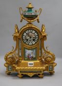 A French gilt painted clock, with porcelain panels