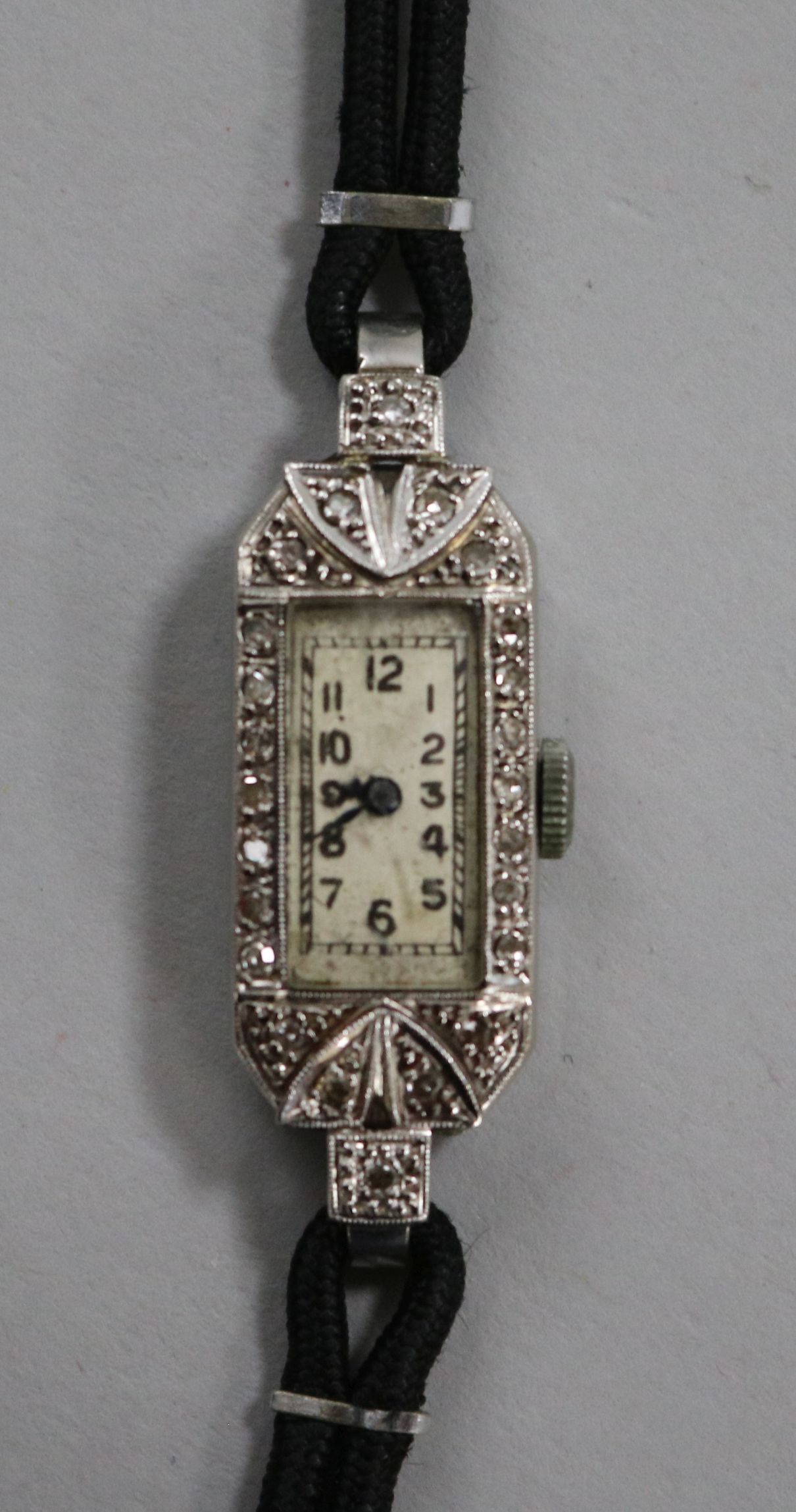 A lady's 1930's/1940's 18ct gold, platinum and diamond set cocktail watch.