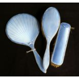 A 1930's silver and blue enamel three piece brush and mirror set.