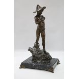 A bronze of a fisherboy, signed, on marble base