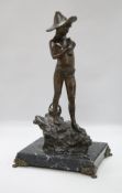 A bronze of a fisherboy, signed, on marble base
