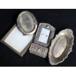 A rectangular embossed silver box, Chester 1895, Nathan & Hayes, an oval pierced silver dish and