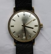 A gentleman's 1970's 9ct gold Garrard automatic wrist watch, with case back inscription.