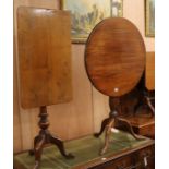 A George III mahogany tilt-top circular tripod table and a 19th century mahogany tilt-top