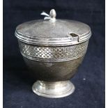 A Tiffany & Co sterling silver vase-shaped sugar bowl and cover, with ovoid finial and pierced