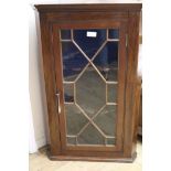 A mahogany glazed hanging corner cabinet, H.100cm