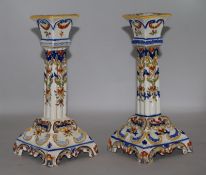 A pair of quimper faience candlesticks