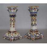 A pair of quimper faience candlesticks