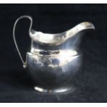 A George III silver cream jug, London, 1805, 10cm.