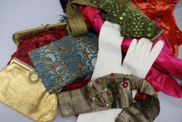 A collection of leather gloves, bags, beaded belts and evening bags, etc.