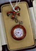 A continental silver gilt and red guilloche enamel fob watch with similar bow suspension brooch.