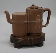 A Yixing double teapot, with wood stand