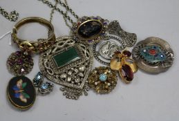 A group of costume jewellery, brooches and pendants.