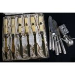 A cased set of French silver and ivory fruit knives, five tea knives, napkin ring and a matchbox