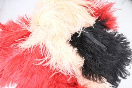 A 1930's feather cape, boa and two feather evening bags