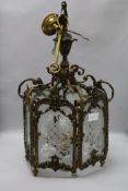 A glass and brass hall lantern