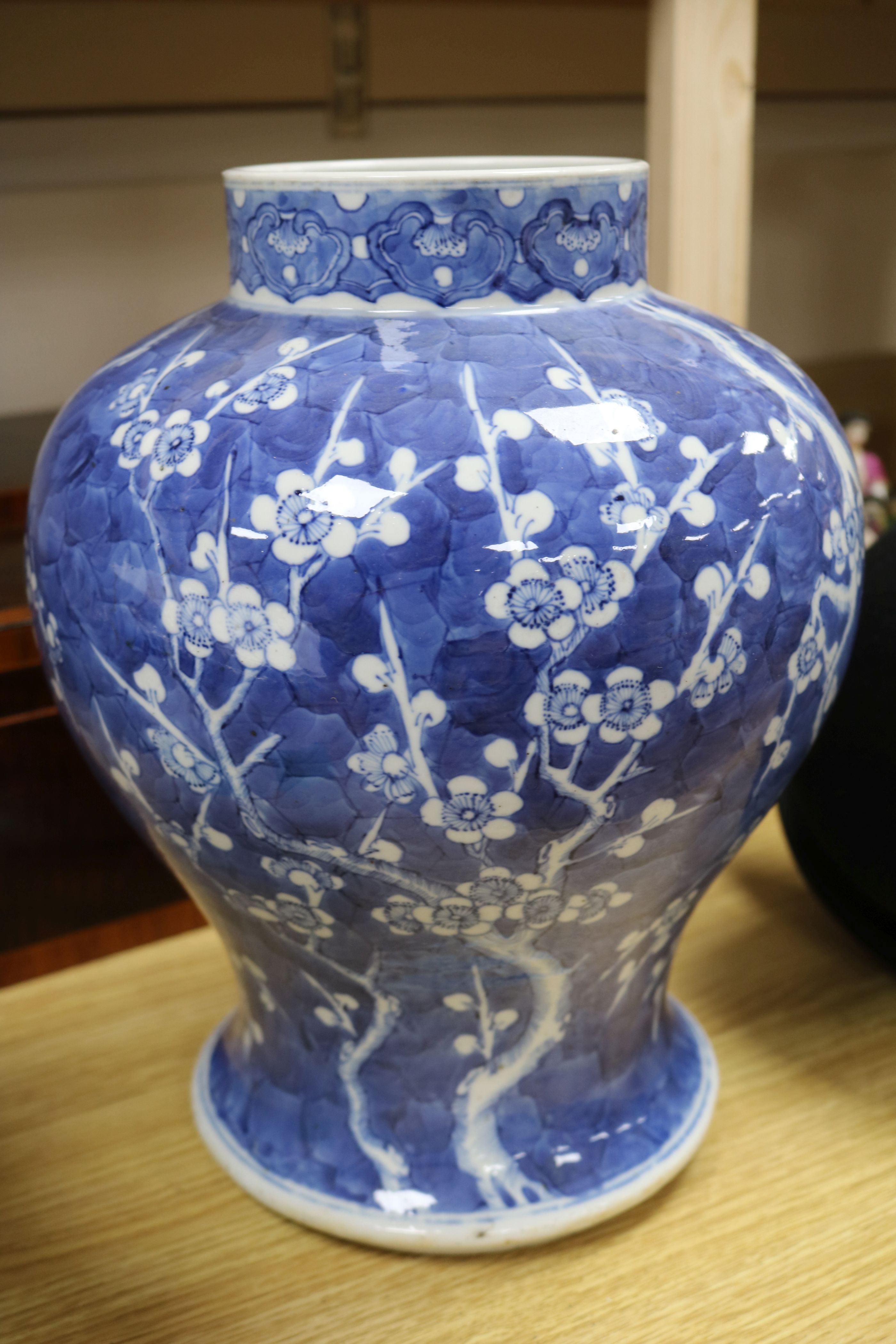 A 19th century Chinese large blue and white baluster vase decorated with prunus - Image 4 of 5