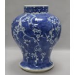 A 19th century Chinese large blue and white baluster vase decorated with prunus