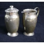 A late 1940's silver milk jug and a matching sugar shaker. 7 oz.