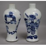 A pair of Chinese blue and white vases, wood stands