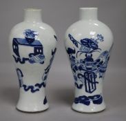 A pair of Chinese blue and white vases, wood stands