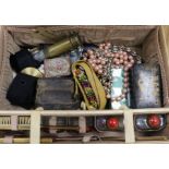 A suitcase with sundries including costume jewellery