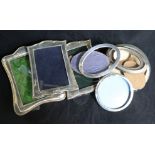 A group of seven assorted silver mounted photograph frames.