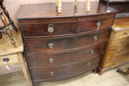 A bow front chest of two short and three long drawers, W.102cm