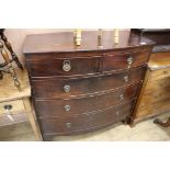 A bow front chest of two short and three long drawers, W.102cm