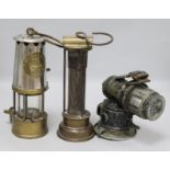 Two miners lamps and a bicycle lamp