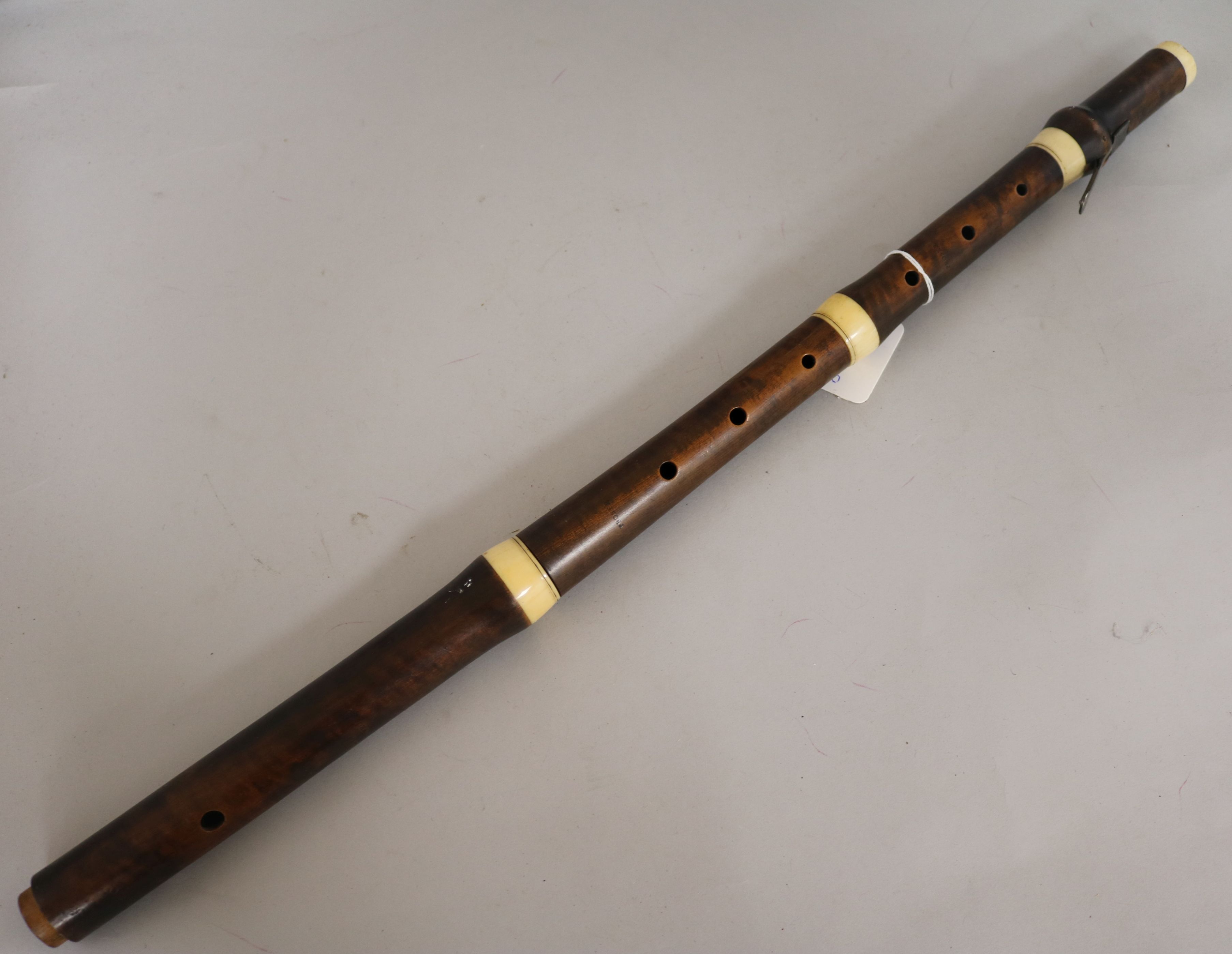 An early 19th Century sycamore and ivory flute, stamped Proser, incomplete